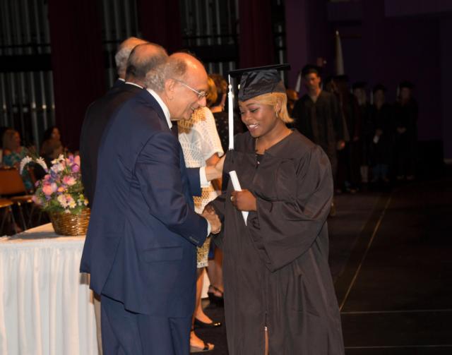 GED graduate Cailynn Lytle shakes L&C President Dr. Dale Chapman’s hand after receiving her GED June 7. Photo by Jan Dona, L&C Media Services.