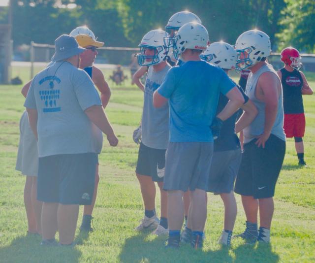 The Panthers huddle up to plan out a play.
