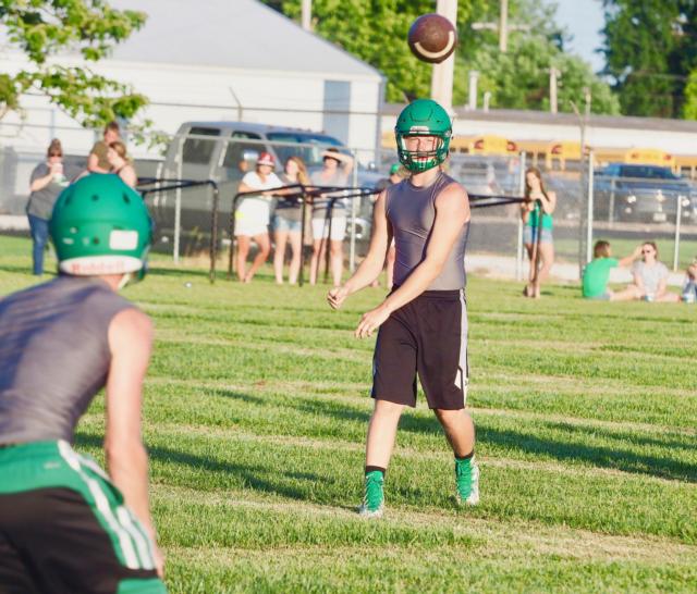 Carrollton Hawks' quarterback Hunter Flowers throws a pass to an open receiver.