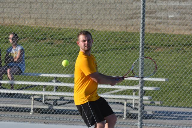 Travis Blair, the men's overall champion of the Alton Tennis Tournament returns a volley. (Photos by Dan Brannan)