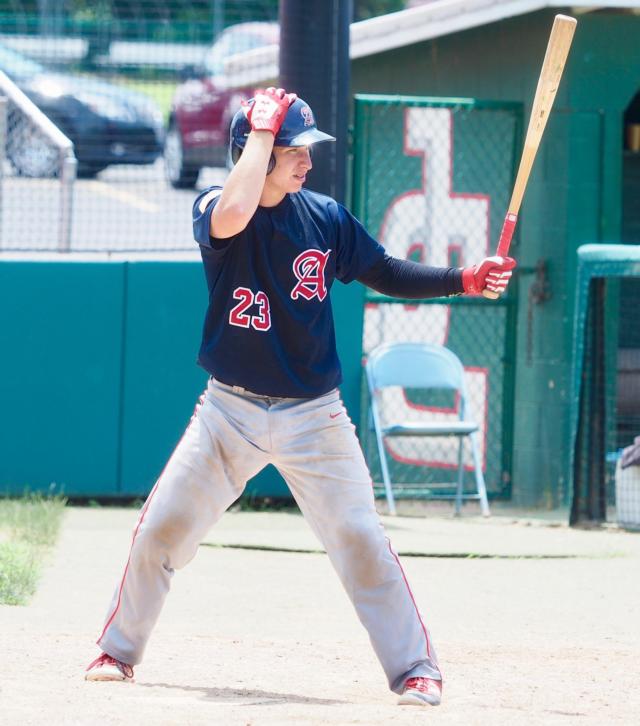 Cullen McBride adjusts his helmet while getting ready to hit.