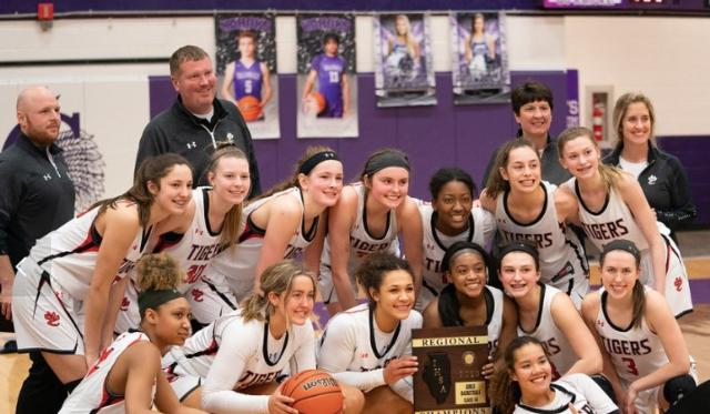 New head Edwardsville girls basketball coach is Caty Ponce, far right.