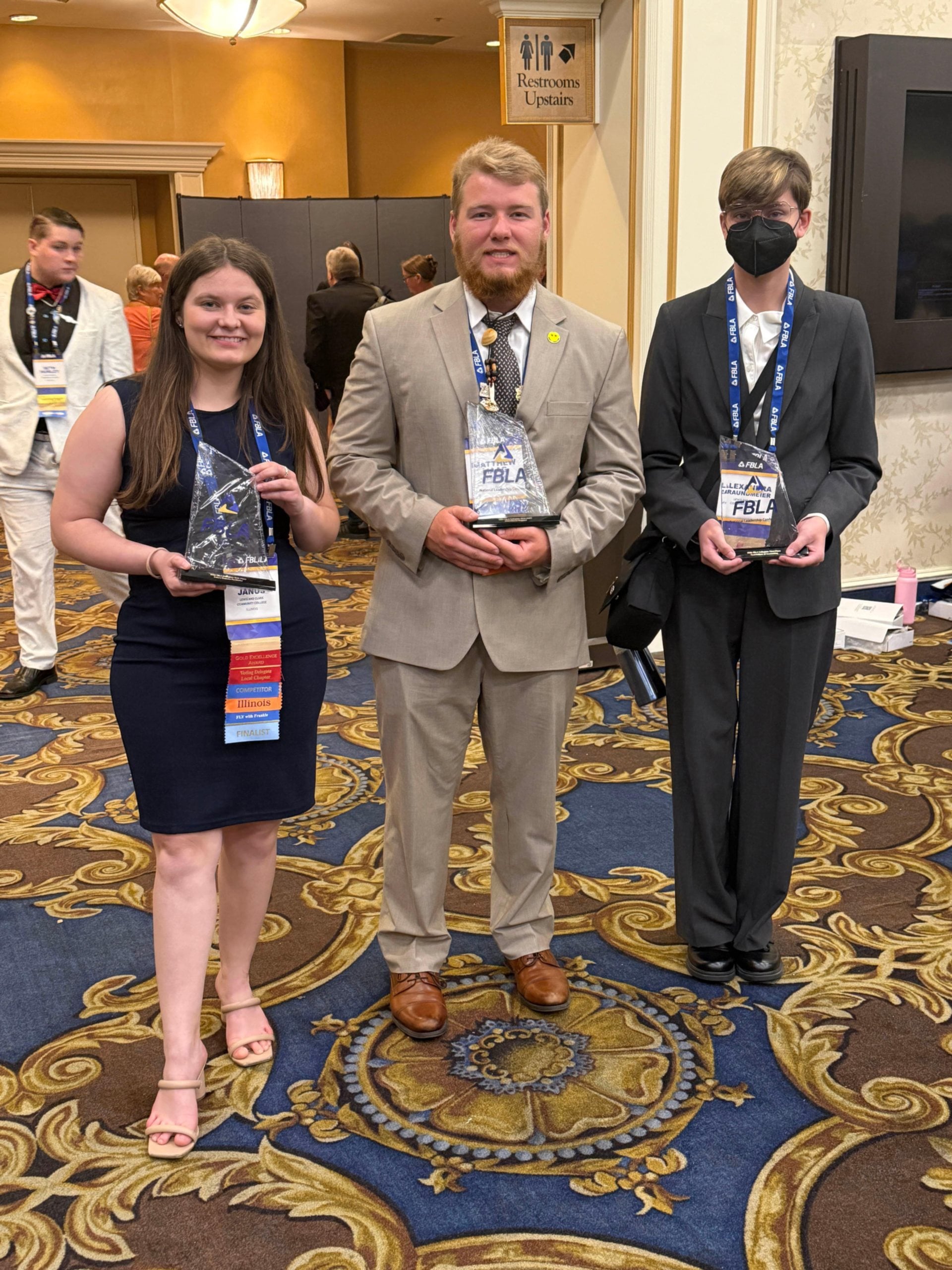 Julia Janus, Matthew Maag and Xander Braundmeir pose with their awards from the competition. Photo by Christina Wickenhauser, LC FBLA Advisor & Associate Professor, Accounting.