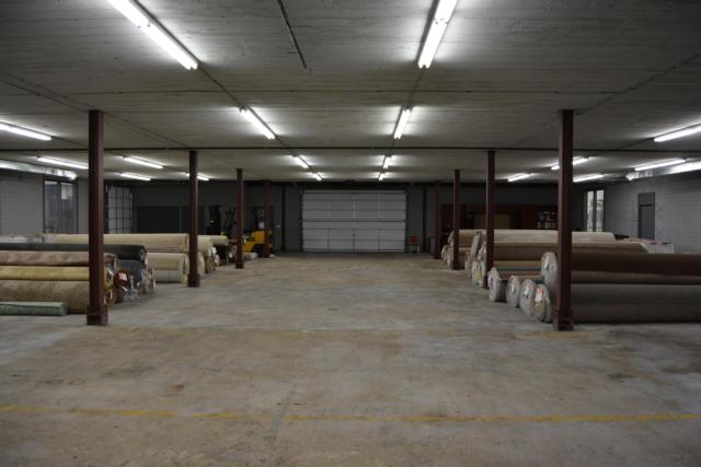 The new Lorton Home Center is about to be filled with home items and will develop in the future. Several rolls of carpet are already available. (Photo by Dan Brannan)