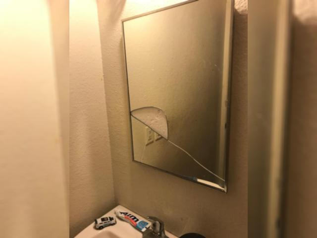 Photo of cracked mirror in condemned home at Belle Manor. Photo taken by Dan Brannan.