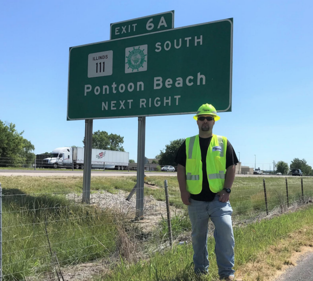 Ryan Lattina, an energy services associate for Ameren Illinois, stands along the frontage road where he performed a Good Samaritan act to assist a motorist after the vehicle inadvertently left the interstate.