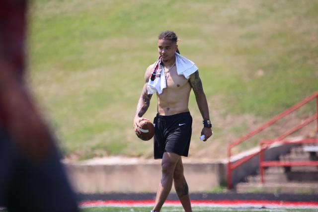Ford walks off the field after helping his team win their 7 vs. 7 practice game. 
