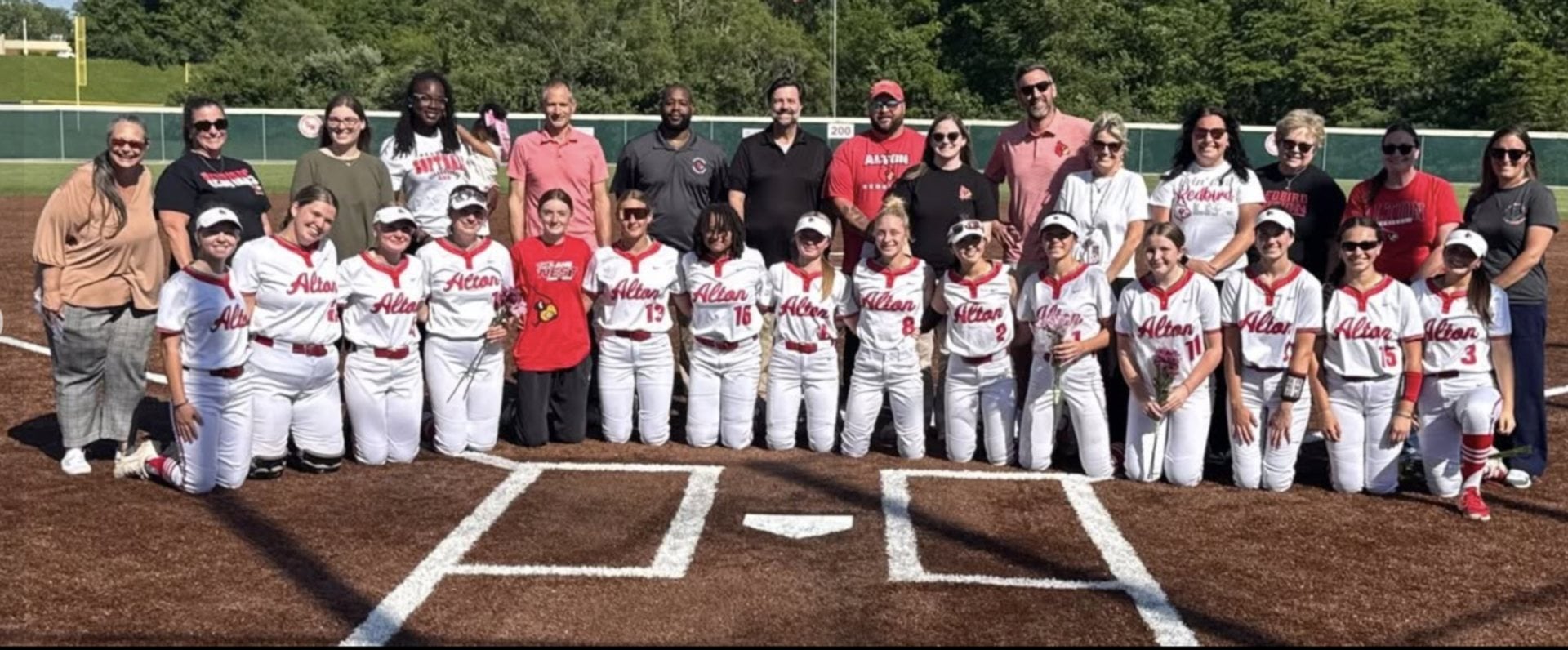 The Redbirds' girls softball team recognized key educators in their high school careers in mid-May 2026 at a home game.