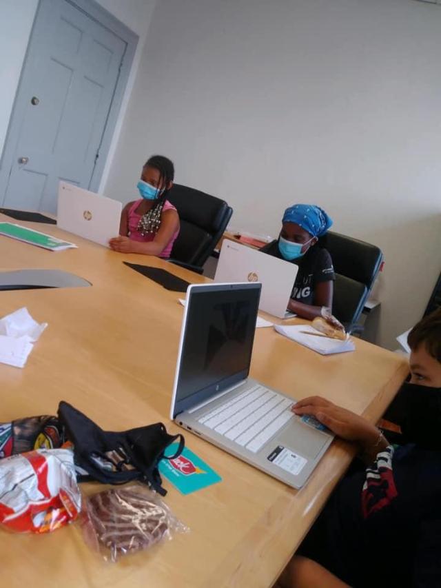 Local students study together on their Chromebook computers. 