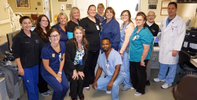 Lyndsey Timmermann of the AMH Emergency Department, standing fifth from left, is the July Alton Memorial Employee of the Month.