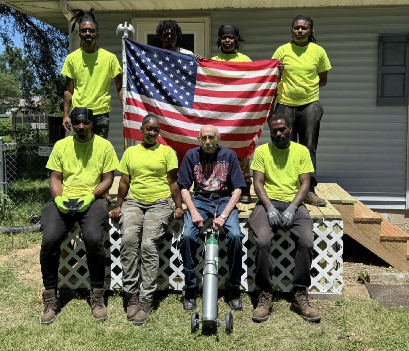 Dave Stout, center, with some SWIC students who put in a new porch for him in Meadowbrook.