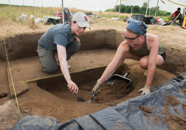 SIUE’s Carol Colaninno-Meeks (left) works with REU participant Emily Lange, of Edwardsville, excavating archaeological deposits.