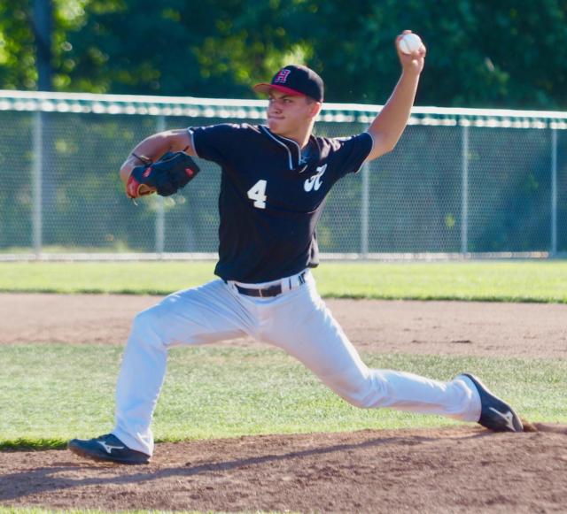 Highland's Conner Pinsker winding up before releasing the ball on the mound.