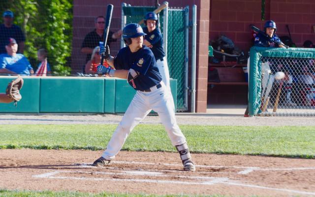 Alton catcher, Ethan Kopsie takes a pitch.