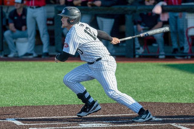 Brennan Orr takes off from home plate after making contact. (Photo by Scott Kane - SIUE Athletics)