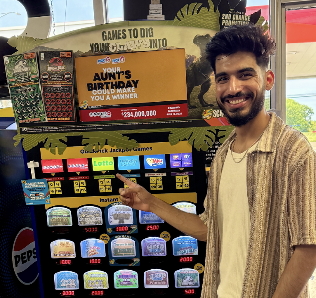 M. Hamza, manager of a Citgo gas station in Justice, is proud after selling a winning $1 million Lotto ticket.