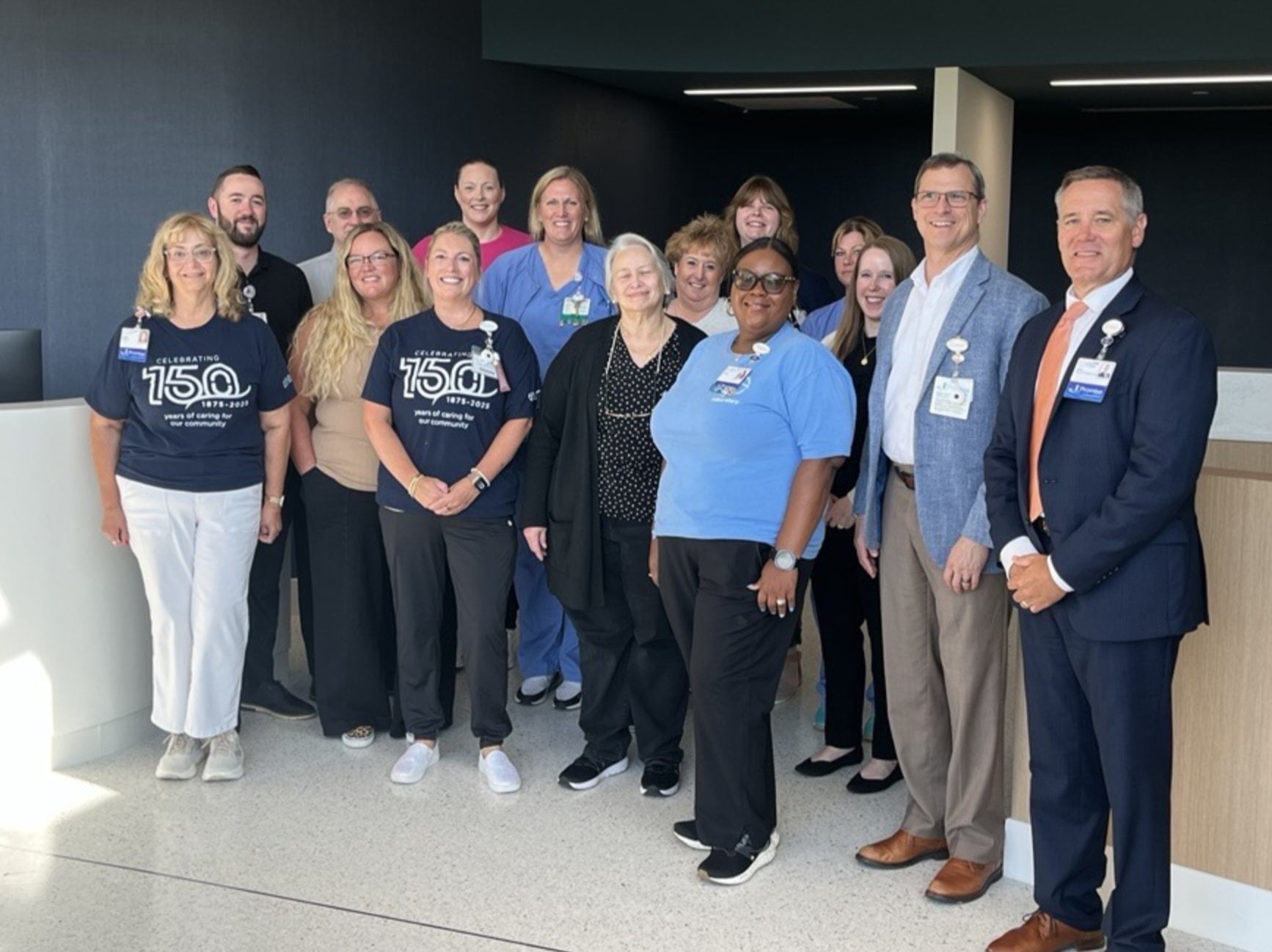 Hospital leadership and registration staff gathered in the new outpatient registration space for a blessing and walkthrough on July 9, 2026, ahead of opening to patients on July 10.