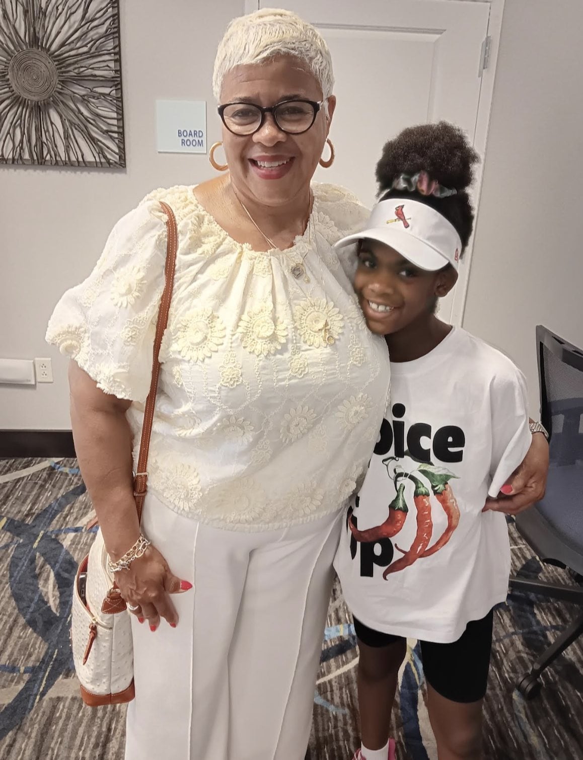 Kimberly Hughes-Gill, president of the East St. Louis Community Tennis Association, and her granddaughter, Kai Moore.