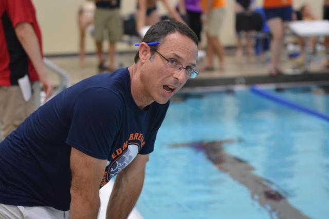 Legendary coach Bob Rettle instructs his swimmers at the Chuck Fruit Independence Meet.