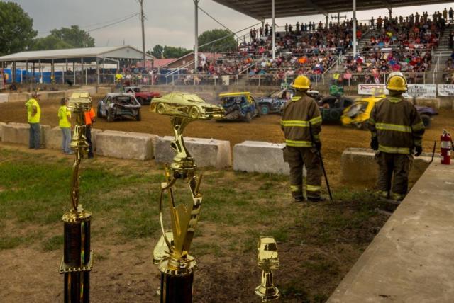 Firemen await patiently for any need during the Demo Derby on Sunday in Jerseyville. (Photo by Michael Weaver)