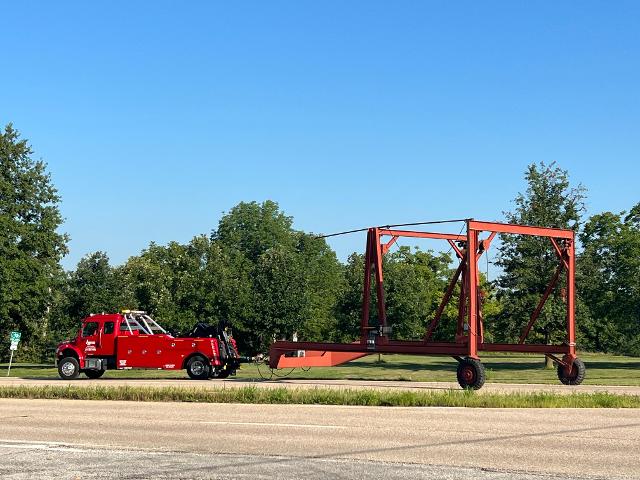 The two truck pulls the hoist out onto Route 100 headed to Grafton. 