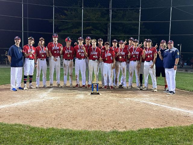 The team poses for a picture with the District 22 trophy. 