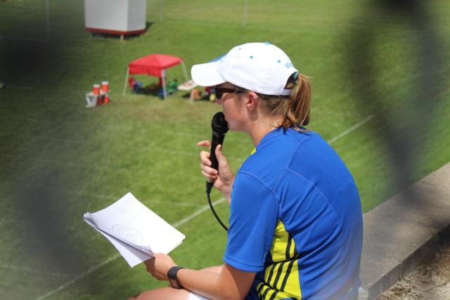 Marching 100 Director Alyssa Cudney looks at the larger picture as she sits above the practice field behind Alton High School, instructing her band members.