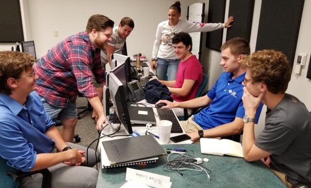In the LRS training room that has become their office, members of the internship program discuss their work. From left to right are Dryden Steele, Jordan Shifflett, Danny Munson, SIUE’s Lyric Boone, Josh Matchuny, Will Lindsey and Alex Cawley. SIUE’s Spencer Lemay was unavailable for the photo.
