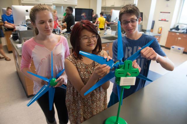 (L-R) Allyson Lunsford, Qiong Domingue and Montgomery Hubler adjust the blade angles on a wind turbine during their renewable energy course.