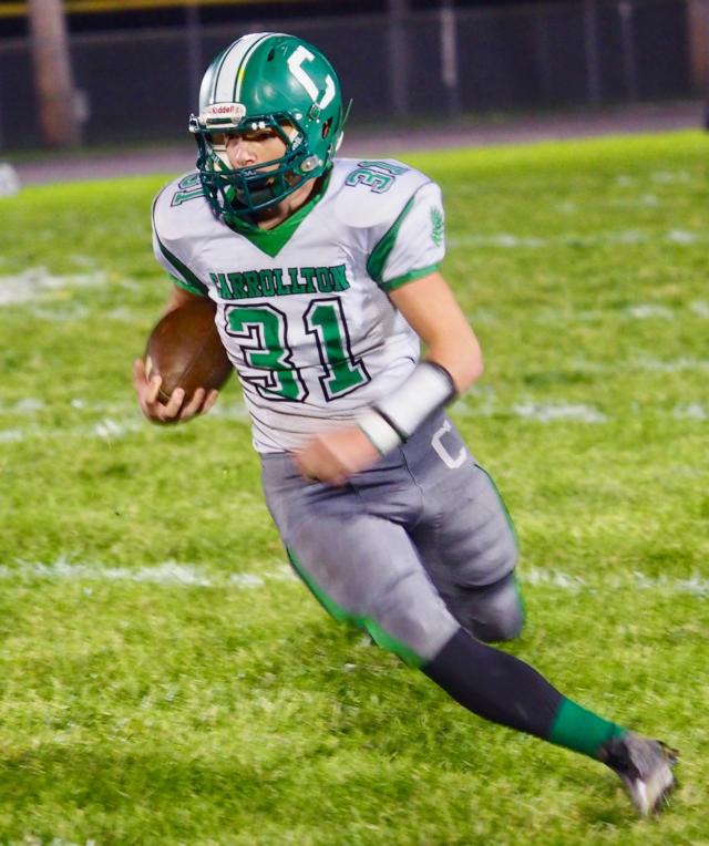 Holmes carries the football against Camp Point Central in Week Nine of the 2017 season.