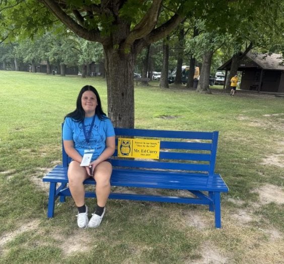 Caitlyn Stafford on the Ed Curry memorial bench.