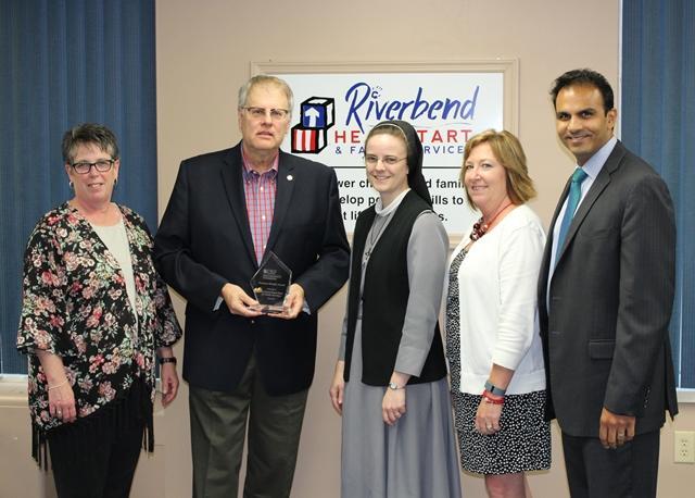 (From Left) Human Resources Director Lori Bostick and President Chuck Parr of Riverbend Head Start receive the Business Health Award from Sr. M. Anselma, COO of OSF Saint Anthony’s; Monica Bristow, President of Riverbend Growth Association; and Ajay Pathak, President and CEO of Saint Anthony’s. For more information on the Business Health Award, call OSF Saint Anthony’s Foundation at 618-463-5168.