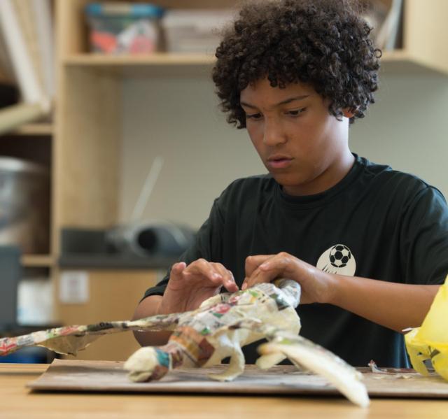 Andrew Nwacha, of Glen Carbon, works on his sculpture.