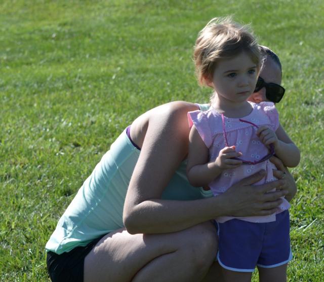 A mother seems to be encouraging a youngster on to consider running in the future at the Mud Mountain race on Saturday. (All remaining photos by Dan Brannan)