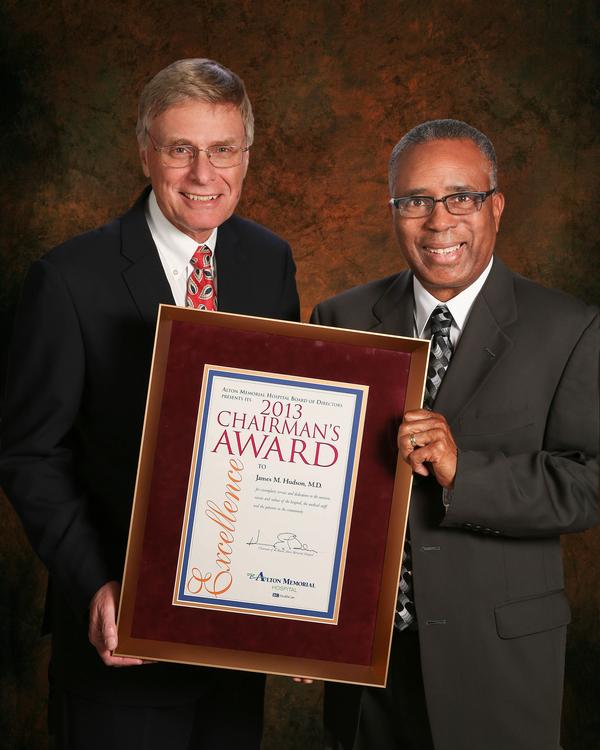 Dr. James Hudson, right, accepts Alton Memorial Hospital&rsquo;s 2013 Chairman&rsquo;s Award from Ken Balsters, chairman of the AMH board of directors.