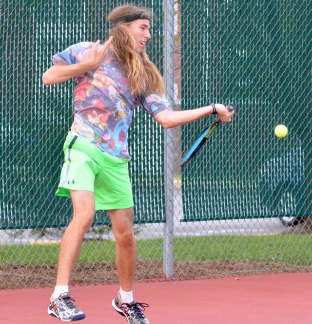 Edwardsville's Erik Weiler returns a serve.