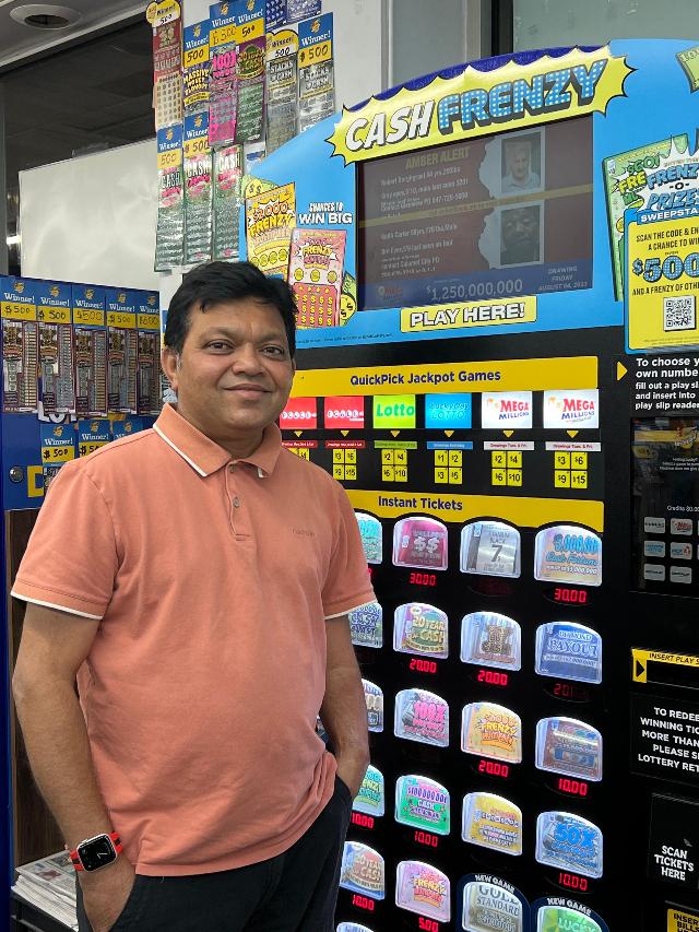 Bhupendra Patel, store owner of Kostner Korner in Skokie, is all smiles after selling a winning Lucky Day Lotto ticket worth $700,000.