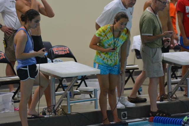 Kate May volunteers as a timer at a recent Edwardsville meet. May's family are key volunteers for the Edwardsville swim program, Coach Bob Rettle said. May is a completely devoted swimmer and supports her teammates when she is training for higher level meets.