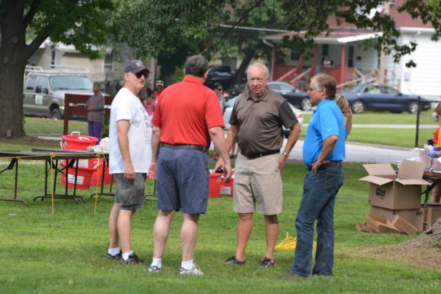 Alton Mayor Brant Walker, State Rep. Dan Beiser and Rick Faccin talked before the start of the Back To School, Stay In School event.