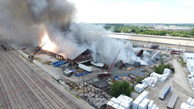 A large spark is captured during the Madison warehouse fire on Wednesday. (Photos by John Hentrich)