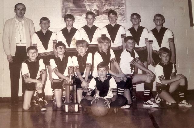 This is a Meadowbrook grade school basketball team from many years ago. The coach is the boys' sixth-grade teacher Ken Wallace. Kevin Stallings is third from left back row. McRae is fifth from left back row.