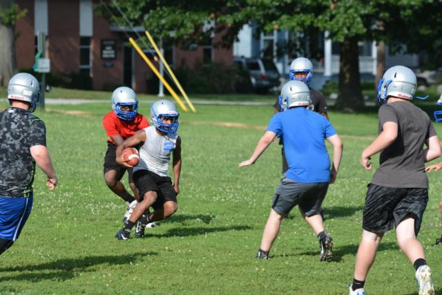 Marquette Catholic High School's running game appears strong from a look at a practice on Monday night.