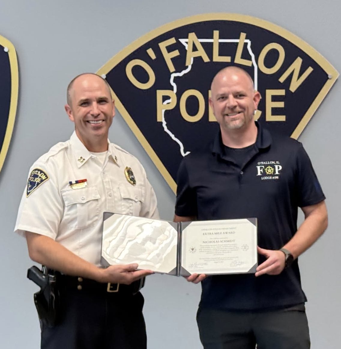 Sergeant Nick Schmidt captures Extra Mile Award.