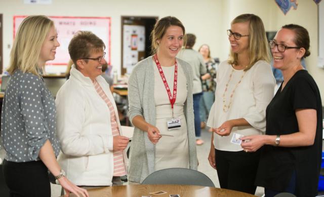 Elizabeth McKenney, PhD, associate professor of school psychology (second from right) participates in an activity with a group of school psychologists during a workshop, entitled, Instructing and Supporting Students with Autism Spectrum Disorder.