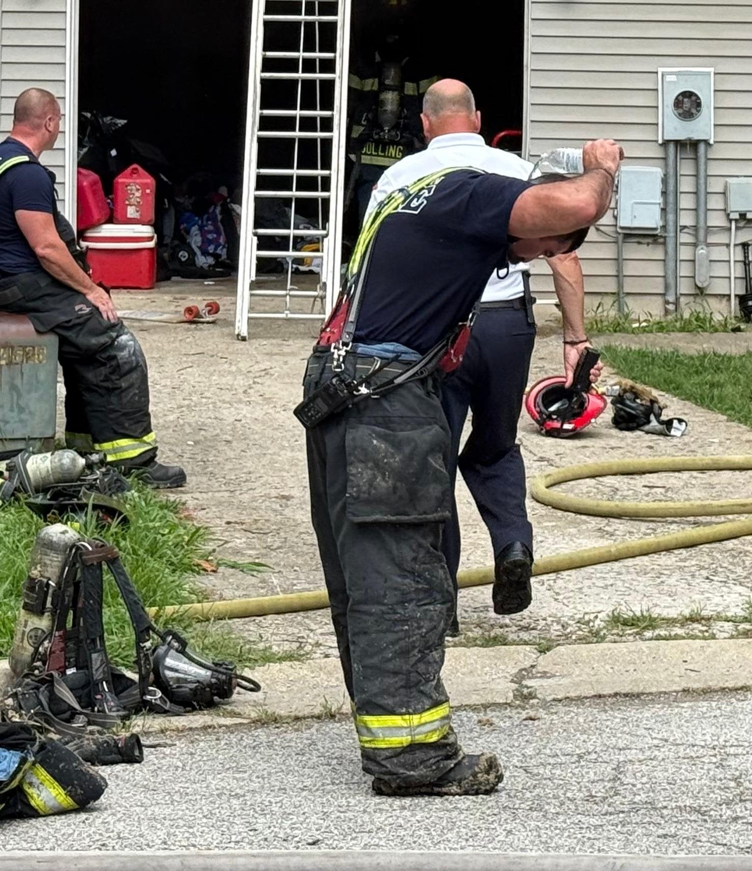 Firefighters contended with the excessive heat while battling a blaze on Delta Queen Lane in Godfrey on Friday, Aug. 14, 2026.