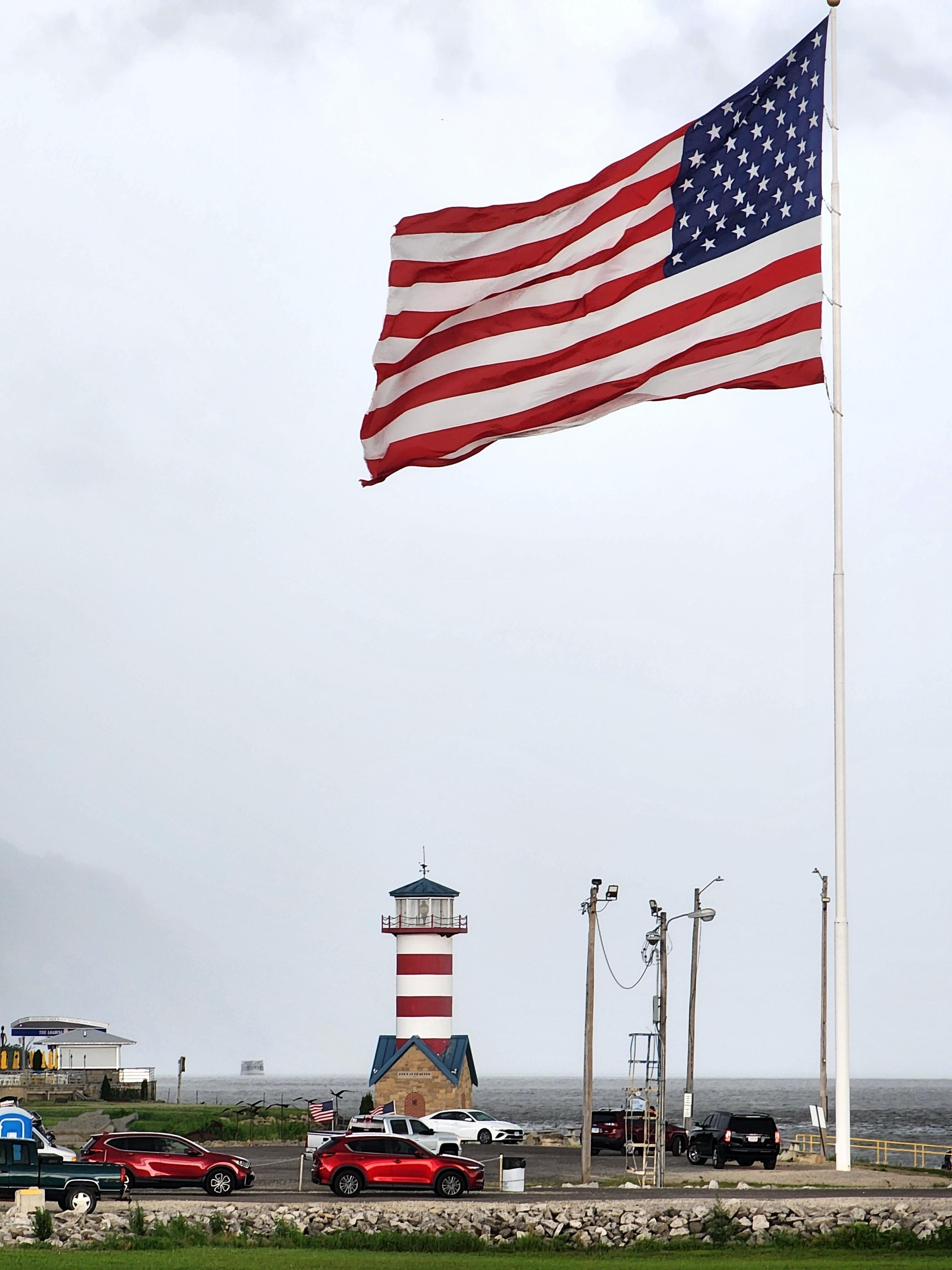 Another winning photo by Patricia Ellington of Grafton shows the Grafton Lighthouse and a large American flag.