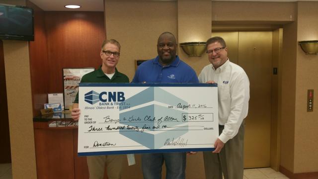 Pictured from left to right: Mark Haggard, CNB Market President, Al Womack, Jr., Boys & Girls Club of Alton, and Mike Drake, CNB Loss Mitigation Specialist.