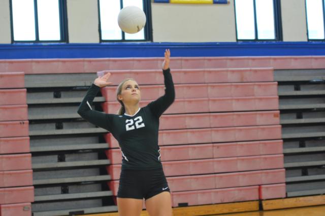 Calhoun's Emily Baalman lets loose a serve against Bunker Hill. (Photo by Dan Brannan)