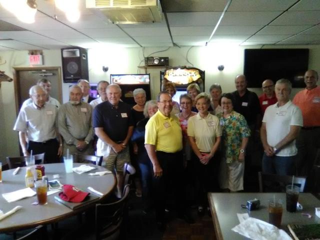 Musgraves, in the yellow shirt, surrounded by his former students from the orchestra at Alton High.