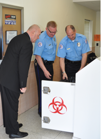 Madison County Sheriff John Lakin, Edwardsville Police Chief Jay Keeven and Lt. Charles Kohlberg inspect some of the collection of unused prescription drugs.